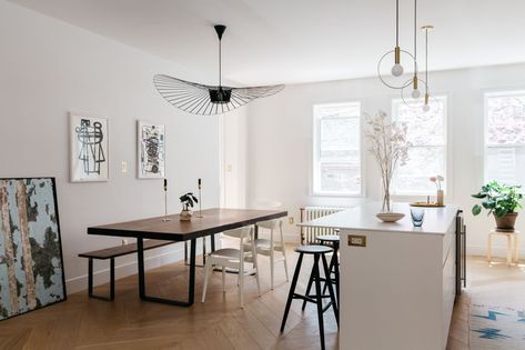 A view of the open kitchen/dining area with a Constance Guisset Vertigo Pendant Lamp. Townhouse Modern, Mid Century Bedroom Decor, Vertigo Pendant, Townhouse Renovation, Lavatory Design, Brooklyn Townhouse, Pink Living Room Decor, Gray And White Bathroom, Scandinavian Dining Room