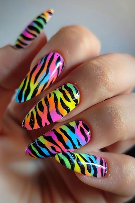 Unleash your wild side with 27 stunning animal print nail designs! From fierce leopard spots to stylish zebra stripes, find the perfect look to express your bold personality. Neon Animal Print Nails, Animal Print Nail Designs, Stiletto Shaped Nails, Zebra Print Nails, Rainbow Nail Art, Rainbow Nail, Bold Personality, Fierce Animals, Heart Nail Designs