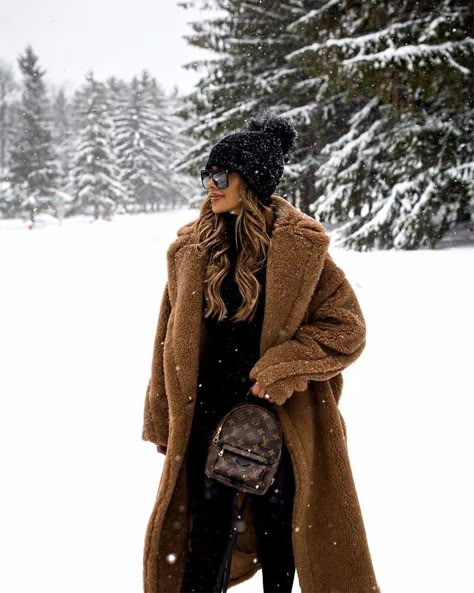 Fashion blogger mia mia mine wears a cozy cute snow outfit for winter by layering a teddy bear coat over an all black outfit. Click through to see more cozy winter layers, chic snow outfits for women, otk boots, how to wear over the knee boots, black and brown outfits, brown fashion aesthetic, and more. #winteroutfits #snowoutfits #womensfashion #style Teddy Bear Coat Outfit, Teddy Coat Outfit, Maria Vizuete, Snow Outfits For Women, Luxurious Gifts, Mia Mia Mine, Snow Photoshoot, Winter Coat Outfits, Perfect Winter Outfit