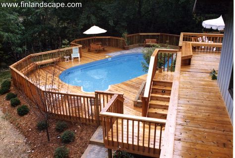 A hillside back yard including a swimming pool, multilevel decks and patios surrounded with new plantings. Multi Level Deck, Pool Deck Plans, Tiered Deck, Best Above Ground Pool, Swimming Pool Decks, Deck Designs Backyard, Above Ground Pool Decks, Backyard Pool Landscaping, Decks Backyard