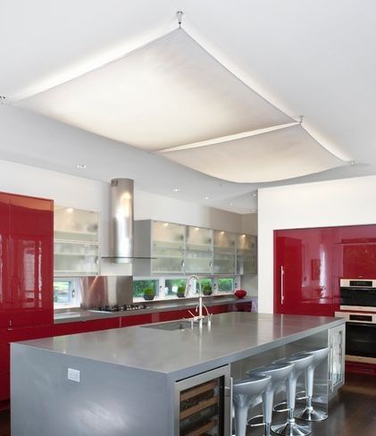 Clever ways to overcome an interior style burden:  overhead fluorescent lamps. Lighting Makeover, Fluorescent Light Covers, Owner Builder, Red Cabinets, Fluorescent Lamp, Red Kitchen, Fluorescent Light, Ikea Hacks, Raised Beds