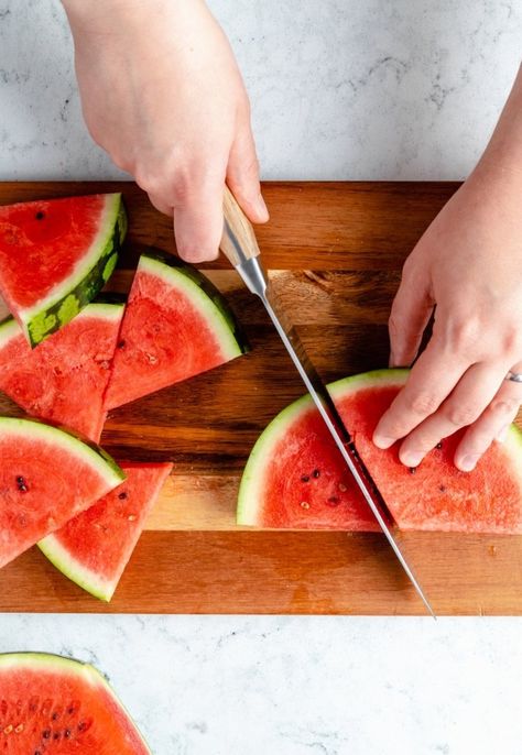 Learn exactly how to cut a watermelon into triangles, cubes or melon balls! With this step-by-step tutorial, you'll be able to safely and easily cut a watermelon in just a few simple steps. Use fresh-cut watermelon in your favorite summer recipes! #howto #kitchenhack #tutorial #watermelon Watermelon Hacks, Cut A Watermelon, Watermelon Uses, Watermelon Ball, Cauliflower Pizza Crust Recipe, Freezing Herbs, Frozen Watermelon, Just A Taste, Ambitious Kitchen