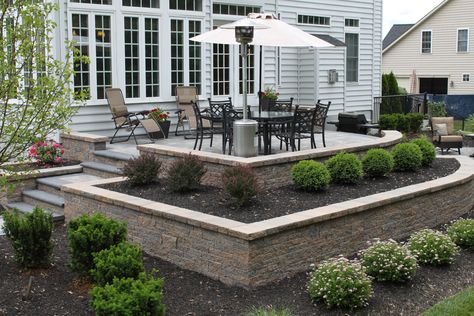 Raised patio using planter boxes and retaining wall, by R&R Caddick Landscape Retaining Wall Patio, Raised Patio, Patio Pavers Design, Patio Steps, Landscaping Retaining Walls, Patio Wall, Front Patio, Patio Landscaping, Pergola Patio