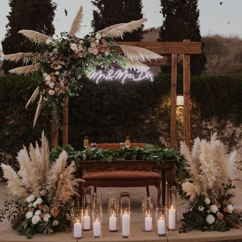 Florals By Jenny on Instagram: "Boho vibes 🌾✨ @lexandjake @arroyotrabucoevents #pampasgrass #bohowedding #sweethearttable #weddingarch" Wooden Wedding Decorations, Rustic Sweetheart Table, Wedding Sweetheart Table Decor, Wedding Arch Ideas, Boho Wedding Arch, Engagement Themes, Arch Designs, Sweetheart Table Decor, Arch Ideas