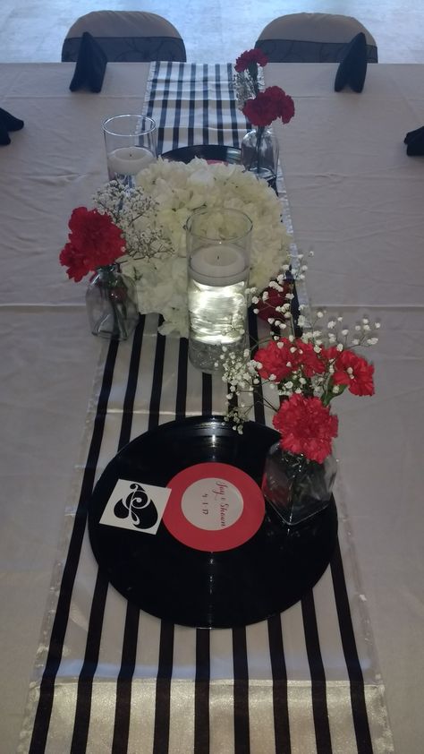 Music lovers wedding, music  theme, flowers, hydrangeas, record guest by book, guitar centerpieces, music theme centerpieces, unique centerpieces by www.eventsandfloral.com Guitar Themed Party, Musical Centerpieces, Band Party Decorations, Guitar Centerpieces, Music Lovers Wedding, Music Theme Party, Music Centerpieces, Elvis Christmas, Music Party Decorations