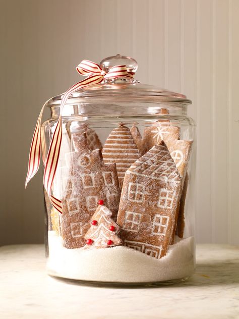 Gingerbread decorations are among the best Christmas decor ideas since you can eat them after you enjoy their beauty! Start with our classic gingerbread recipe, use our template to shape a gingerbread city, and sprinkle with powdered sugar. Cool Gingerbread Houses, Gingerbread House Recipe, Candle Table Centerpieces, Centerpiece Christmas, Festive Centerpieces, Gingerbread Village, Gingerbread Decorations, Christmas Table Centerpieces, Gingerbread Recipe