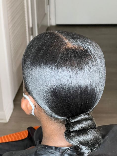 Black Low Bun Hairstyles, Sleek Low Ponytail Black Women Middle Part, Low Bun Knot Black Women, Sleek Low Bun Black Women Middle Part, Middle Part Top Knot Bun, Low Bun Middle Part Black Women, Low Knot Bun Middle Part, Low Bun Ponytail Black Hair, Low Bun With Braiding Hair