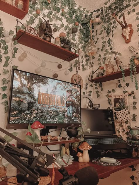 Witchy Gamer Room, Aesthetic Gaming Setup Plants, Light Academia Gaming Setup, Goblincore Gaming Setup, Cozy Video Game Aesthetic, Cottage Core Pc Set Up, Cottage Core Gaming Setup, Forest Gaming Setup, Plant Gaming Setup