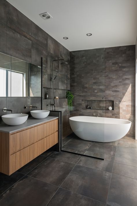 This is the master bedroom ensuite bathroom  on the top floor in this three level inner city townhouse. Fully tiled walls, custom vanity with double vessel basins and aged iron tap ware, mirror cabinet for more storage. Beautiful big walk in shower/ wet room end of the bathroom with freestanding oval shaped bath.  #ledmirror #bathroomdesign #renovation #vesselbasin #timbervanity #bathroom #tapware #apartment #walkinshower #freestandingbath #modern Fully Tiled Bathroom, Bathroom Freestanding, Bathroom Inspiration Modern, Master Ensuite, Ensuite Bathrooms, Ensuite Bathroom, Casa Container, Bathroom Inspiration Decor, Big Bathrooms