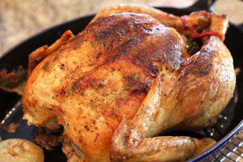 This whole roasted chicken is stuffed with a savory bread dressing. This is the chicken recipe you need to prepare for your Sunday dinner. Whole Chicken Recipes Easy, Whole Roast Chicken, Chicken Whole, Baked Chicken Recipes Oven, Chicken Recipes Easy, Bread Dressing, Oven Chicken Recipes, Whole Chicken Recipes, Herb Bread