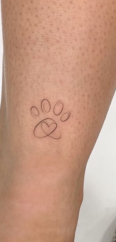 Fineline Dog Paw Tattoo, Dog Paw Initial Tattoo, Paw Angel Tattoo, Minimal Paw Tattoo, Small Pawprint Tattoos, Fine Line Dog Paw Tattoo, Cat Memorial Tattoo Minimalist, Dog Ankle Tattoos For Women, Small Dog Paw Tattoos For Women