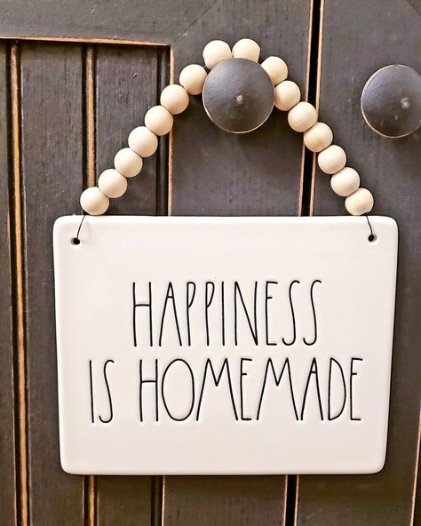 Found the cutest Rae Dunn sign and added wood beads to it.... #raedunn #sign #happinessishomeade #farmhouse Diy Gallery Wall, Hutch Decor, Farmhouse Crafts, Rae Dunn Collection, Mesh Wreath Diy, Holiday Beading, Ceramic Wall Decor, Pool Signs, Wooden Bead Garland