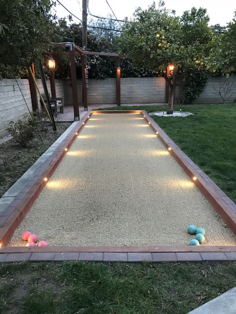 Outdoor Bocce Ball Court, Backyard Bacci Ball Court, Built In Yard Games, Backyard Bocce Court, Cornhole Court Backyard Diy, Bachi Ball Court, Botchy Ball Court, Horseshoe Pits Backyard, Fun Things To Have In Your Backyard