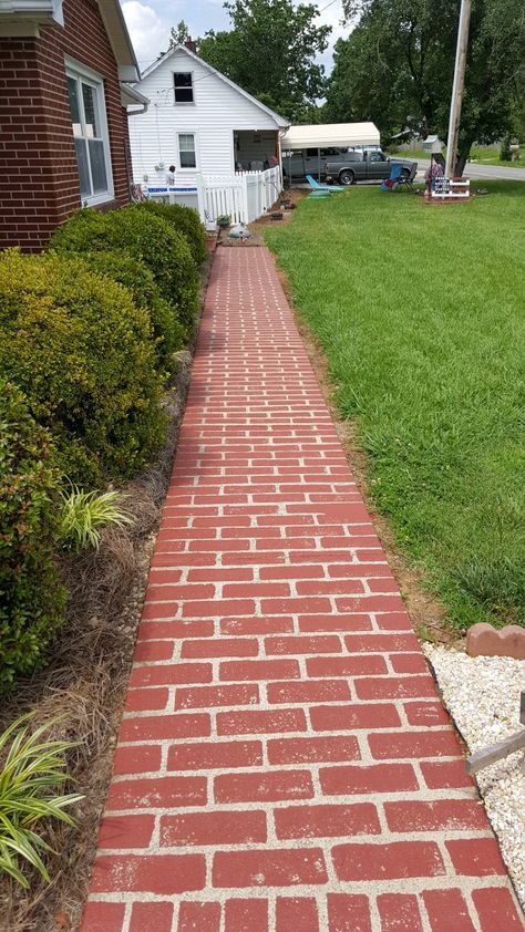 Faux brick on concrete.  We used Bher     concrete with half epoxy paint mixed in brick red. We used a mop sponge to make it match the original brick on the house. Painted Brick Pathway, Brick And Cement Walkway, Patio Red Brick, Red Brick Path, Red Pavers Brick Exteriro, Brick Sidewalk, Cottage Patio, Brick Porch, Concrete Patio Makeover