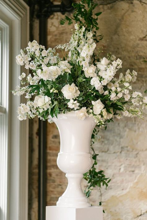 White Flower Ceremony, Wedding Ceremony Urn Arrangements, Urn Floral Arrangements Wedding, White Floral Ground Arrangement, White Flower Urns Wedding, Floral Urns Wedding Ceremony, Green Ceremony, Flower Ceremony, Tall White Vase