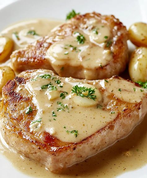 Creamy Baked Pork Chops Recipe - avarecipes.com Baked Mushroom Pork Chops, Bone Pork Chop Recipes Oven Baked, 2 Pork Chop Recipes, Pork Chops Scalloped Potatoes Casseroles, Baked Bone In Pork Chop Recipes, Crispy Oven Baked Pork Chops Bone In, Pork Chops Bone In Oven, Thick Pork Chop Recipes Oven, Creamy Baked Pork Chops Oven