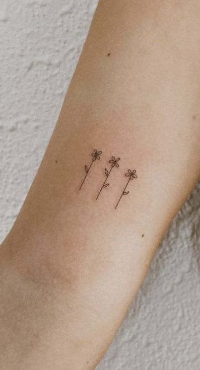 Ditsy Tattoo, Fun Dainty Tattoos, Above Back Of Elbow Tattoo, 3 Daisy Tattoo, Danty Tattoos Small Flowers, Simple Tattoos For Family, Dainty Tattoo For Kids, 3 Daisies Tattoo, Family Tattoos Flowers