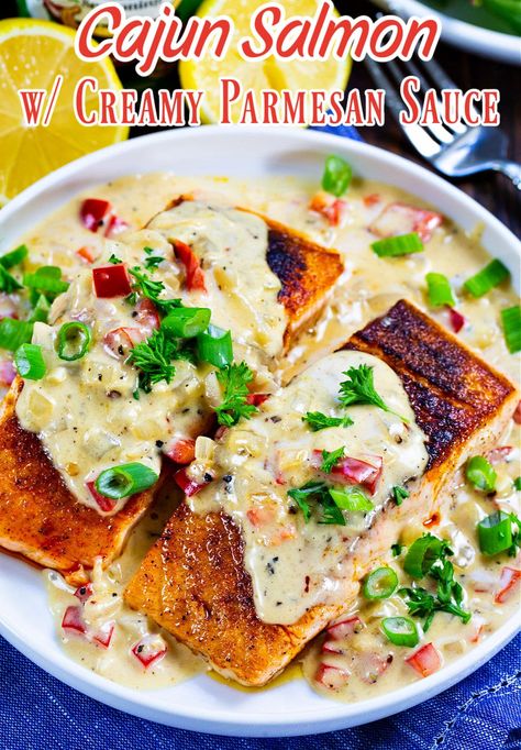 Cajun Salmon with Creamy Parmesan Sauce Salmon And Crawfish Recipes, Creamy Jerk Sauce, Cajun Cream Sauce For Fish, Salmon With Parmesan Cream Sauce, Salmon Cajun Cream Sauce, Blackened Salmon In Creamy Cajun Sauce, Cajun Butter Salmon, Cajun Fish Recipes, Parmesan Salmon