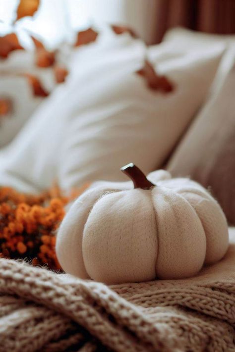 Step into a tranquil bedroom oasis that embodies the gentle spirit of fall. Imagine a softly lit room adorned with a beige knitted throw, exuding cozy warmth, and crowned by a fluffy white pumpkin. This is the essence of serene comfort and autumn's charm, a peaceful retreat that captures the delicate beauty of the season in its most inviting form. 🍁🍂🌙 Fall Aesthetic White, Autumn Bedroom Ideas, Autumn Aesthetic Cozy, Cozy Autumn Aesthetic, Bedroom Ideas Cozy, Autumn Bedroom, Cozy Fall Aesthetic, White Pumpkin Decor, Gentle Spirit