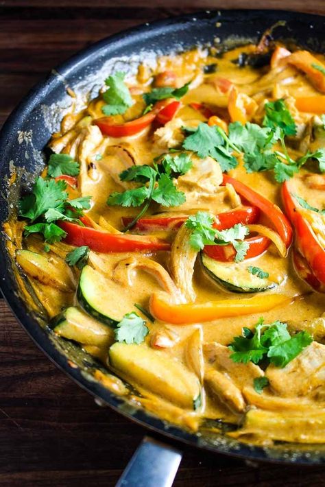 This Thai red curry recipe is a 30 minute meal that is easy to make, and even easier to love! Chicken and veggies are quickly sauteed and then cooked in a creamy coconut milk and red curry paste sauce. Served over rice, it's a healthy stir fry that is filling, comforting and delicious. #Thaifood, #chicken, #chickenrecipes Thai Red Curry Recipe, Red Curry Recipe, Red Curry Sauce, Red Curry Chicken, Healthy Stir Fry, Chicken And Veggies, Thai Street Food, Thai Curry, Sticky Rice