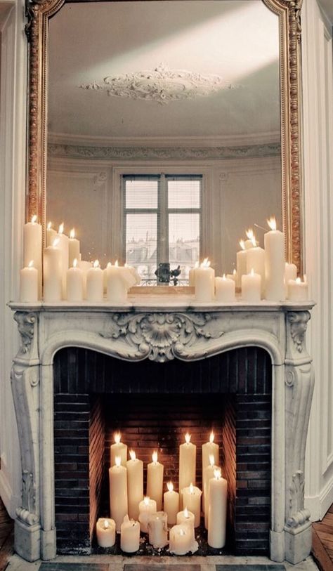 Paris Living Room Aesthetic, Pillar Candles In Fireplace, Electric Candles In Fireplace, Staged Fireplace, Goth Fireplace, Vintage Fireplace Mantle Decor, Fireplace With Candles Inside, Fireplace Candles Inside, Candles In Fireplace Ideas