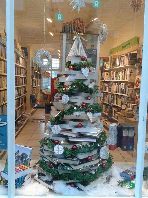 Book tree at Oxfam in Cornwall, England.  Great idea for the tree topper! Scholastic Book Fair, Book Christmas Tree, Book Tree, Store Window Displays, Alternative Christmas Tree, Easy Christmas Diy, Book Display, Book Projects, Tree Toppers