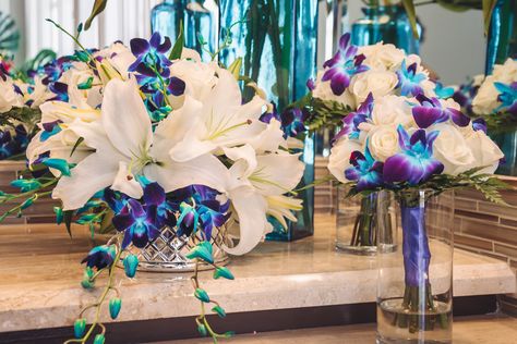 Wedding Centerpiece with White Oriental Lilies and Blue Orchids Blue Orchid Wedding Decorations, Galaxy Orchid Centerpieces Wedding, Stargazer Lily Centerpieces Wedding, Blue Orchid Centerpieces, Orchid Centerpieces Wedding, Blue Orchid Wedding, Moonlight Wedding, White Lily Bouquet, Orchid Centerpiece