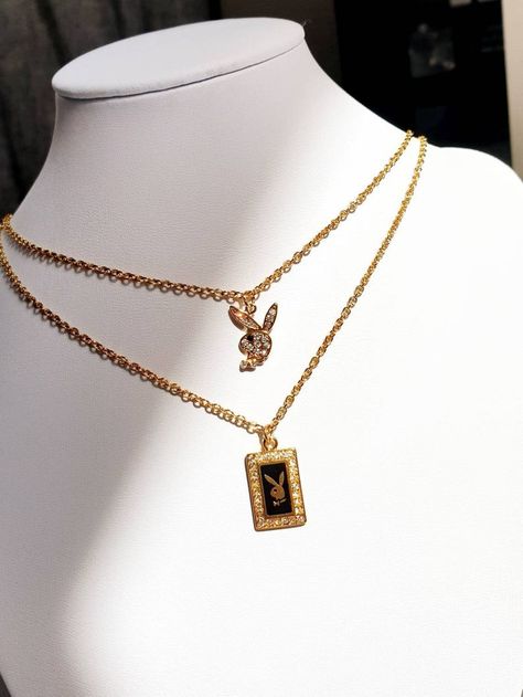 Two gold plated playboy bunny Necklaces on a white necklace stand Playboy Necklace Gold, Stylish Gold Earrings, Playboy Necklace, Engagement Ring Non Traditional, Necklace Women Gold, Women Gold Chain, Bunny Necklace, Y2k Necklace, Chain Necklace Gold