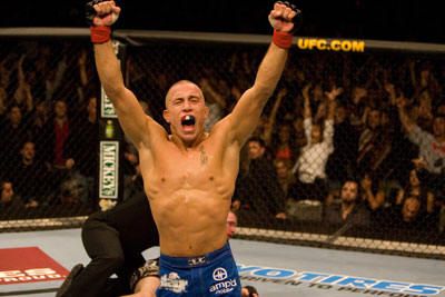 Georges St. Pierre claims UFC gold for the first time at UFC 65. I love this for all the fans in the back are doing the same thing he is. <3 Gsp Ufc, George Saint Pierre, Georges St Pierre, George St Pierre, St Pierre, Combat Sports, Mma Fighters, Mixed Martial Arts, Muay Thai