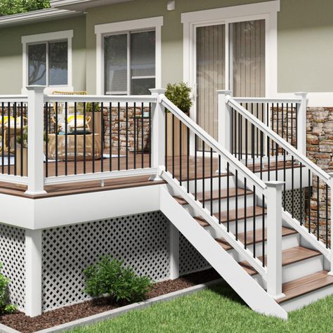 Cape Cod Porch Railing, White Deck Railing Ideas, Raised Patio With Railings, Backdoor Steps To Patio With Railing, Vinyl Deck Railing Ideas, High Porch Ideas, Tan Deck With White Railing, Pvc Deck Railing Ideas, Wood Deck White Railing