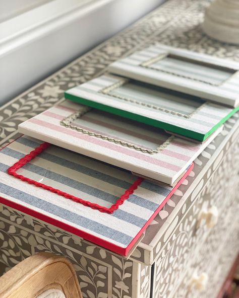 These are my fabric covered photograph frames made of solid oak and covered in my thick linen stripes with ric rac trim. The photo size is 7 x 5 inches and can sit either portrait or landscape. #photoframe #handmade #ricrac #linenphotframe #bespokephotoframes #handmadephotoframe #childrensphotoframe #7x5frame Fabric Covered Frames Diy, Linen Stripes, Handmade Photo Frames, Feminine Bedroom, Ric Rac, Photo Size, Diy Frame, Fabric Covered, Photo Frames