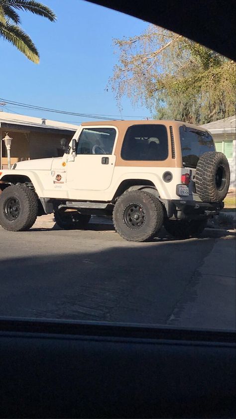 Brown and tan vintage Jeep on road Brown Jeep Aesthetic, Jeep Wrangler Old Model, Older Jeep Wrangler, Small Jeep Cars, Cream Jeep Wrangler, 2000s Jeep Wrangler, Aesthetic Jeep Interior, Jeep Wrangler Brown Interior, Vintage Jeep Aesthetic