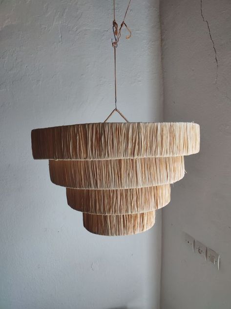 Why you will love a boho-inspired piece with a modern twist , our raffia woven bun - shaped chandelier is a light , comfortable , go with everything solution . the adjustable hanging height makes it suitable for any space . Raffia Pendant Light, Weave Bun, Raffia Lamp, African Interior Design, African Interior, Love A, Different Colors, Color Schemes, Pendant Light