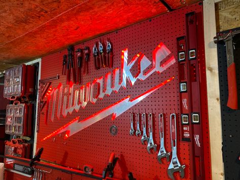 A milwaukee tools back lite pegboard garage center piece. Will update as tools are added Milwaukee Cordless Tools, Milwaukee Tool Box, Tool Pegboard, Pegboard Garage, Garden Tool Rack, Garage Organization Tips, Workbench Plans Diy, Garage Tool Storage, Tool Room