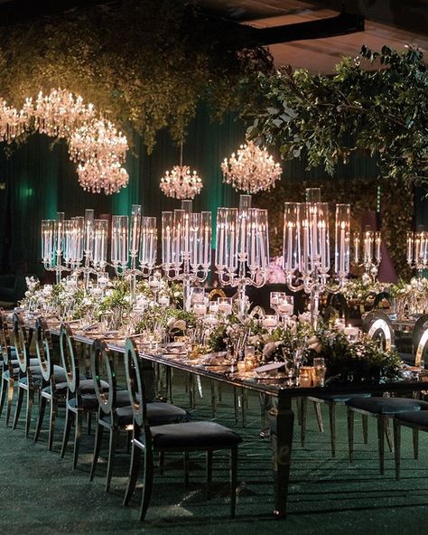 Green with envy. We saturated the room in shades of emerald and hunter green from the grass turf carpeting to the ceiling.  The candelabras and chandeliers added just the right amount of luxe.  Las Vegas Wedding Planner @andreaeppolito  Photo @renezadoriphotography  Floral @javier_valentino  Rentals @palacepartyrental  Venue @arialv @modernluxuryevents  Paper @meldeenink Enchanted Forest Wedding Ceremony, Slytherin Wedding, Emerald Green Wedding Theme, Green Wedding Decorations, Gold Wedding Reception, Aga Khan, Vegas Weddings, Green Themed Wedding, Enchanted Forest Wedding