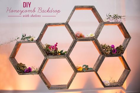 DIY: Honeycomb Backdrop with Shelves Backdrop With Shelves, Honeycomb Backdrop, Diy Honeycomb, Geometric Backdrop, Honeycomb Shelves, Garland Backdrops, Diy Wedding Backdrop, Hexagon Shelves, Wedding Ceremony Backdrop