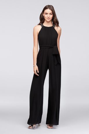 Introduce a new element to bridal party outfitting with this flowing chiffon jumpsuit. At first glance it looks like a traditional gown with a jeweled neckline and open back, but the wide-leg pants offer a fun alternative to the norm.   Reverie, exclusively at David's Bridal  Side pockets  Polyester  Back zipper; fully lined  Dry clean  Imported Freshers Outfit, Bridesmaid Jumpsuit, Traditional Gown, Wedding Pantsuit, Black Pantsuit, Bridesmaids Jumpsuits, Jumpsuit For Wedding Guest, Jump Suits, Traditional Gowns