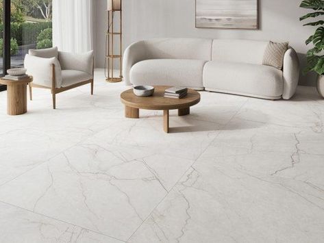 The Class Porcelain Tile Collection, offers a touch of elegance to any space. Available in large format 24″ x 48″ and 48″ x 48″ options. Available in two warm colors, Bianco and Avorio. Inspired by the purity and beauty of Avorio di Segesta marble, these tiles feature fine and delicate veining in earth tones that contrast with the creamy background, creating a captivating visual effect. The Class Porcelain Tile Collection is a versatile and powerful choice for enhancing the beauty of any room. Marble Flooring Design Living Room, Nordic Living Room Inspiration, Tiles Living Room, Creamy Background, Marble Flooring Design, White Marble Tiles, Living Room Tiles, Nordic Living Room, Floor Tile Design