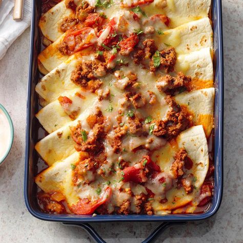 Here's something a little different from the usual tacos— and it's special enough for potlucks or dinner guests.—Deborah Smith, DeWitt, Nebraska Tortilla Bake, Frijoles Refritos, Tortilla Shells, Stewed Tomatoes, Dinner Guests, Monterey Jack Cheese, Minestrone, Casserole Dish, Jamberry