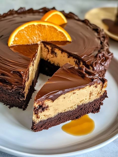 Chocolate Orange Cheesecake Layer Cake 

🍊 Ingredients 🍊
For the Chocolate Cake:
2 cups sugar 🍬
2 cups all-purpose flour 🥣
3/4 cup cocoa powder 🍫
2 tsp baking powder 🧂
1 tsp baking soda 🧪
1/2 tsp salt 🧂
2 eggs 🥚🥚
1 cup soured milk 🥛
1 cup black coffee ☕
1/2 cup vegetable oil 🛢️
1 tsp vanilla extract 🍦
2 oz orange liqueur (optional) 🍊🍸
For the Orange Cheesecake:
1 ½ pounds (3 blocks) cream cheese 🧀
1 cup sugar 🍬
3 eggs 🥚🥚🥚
1 tsp vanilla extract 🍦
3/4 cup whipping cream 🥛 Triple Layer Cheesecake, Orange Chocolate Cheesecake, Cheesecake Layer Cake, Chocolate Orange Cheesecake, Chocolate Orange Cake, Orange Cheesecake, Cheesecake Layer, Sweet Roll Recipe, Orange Chocolate Cake