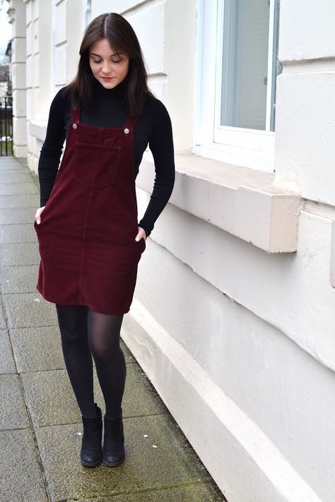 ktcrossthwaite: FASHION: THE LITTLE BURGUNDY DRESS Corduroy Jumper Dress Outfit, Overalls Dress Outfit Fall, Burgundy Overalls Outfit, How To Style Stockings With Dress, Dress With T Shirt Under, How To Style Overall Dress, Corduroy Overall Dress Outfit Fall, Overall Dress With Tights, Corduroy Dress Outfit Fall