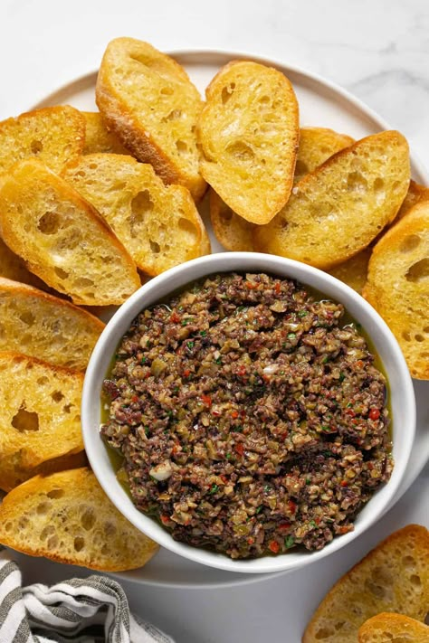 5 Minute Olive Tapenade | This salty, briny olive tapenade recipe comes together in just 5 minutes and is the perfect party appetizer, sandwich topper, hummus enhancer or pizza sauce base. If you love olives, you are going to LOVE LOVE LOVE this recipe! Olive Tamponade Recipes, 2023 Meals, Olive Tapenade Recipe, Tapenade Recipe, Easy Hummus Recipe, French Dinner, Crostini Recipes, Watching Football, Easy Vegetarian Dinner