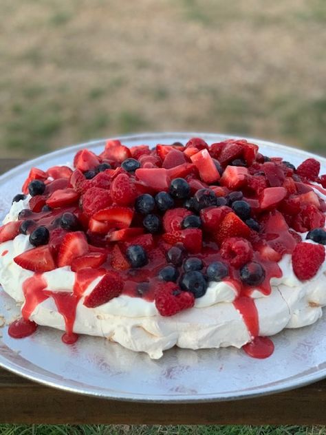 PAVLOVA WITH BERRIES AND CREAM RECIPE I first experienced a Pavlova at a luncheon hosted by the mother of my daughters’ childhood friend, more than 20 years ago. The beautiful hostess was named Anne Marie and this delicate dessert made quite an impression on me! What is a Pavlova? It’s a delicate crisp meringue bottom, filled, in this case, with cream and berries. The crisp sugar meringue with the rich cream and tart berries is an outstanding sweet bite of goodness. Mary Berry Pavlova, Berries And Cream Recipe, Red Foods, Berry Coulis, Berries And Cream, Vanilla Filling, Pavlova Recipe, Recipe Blog, Red Food