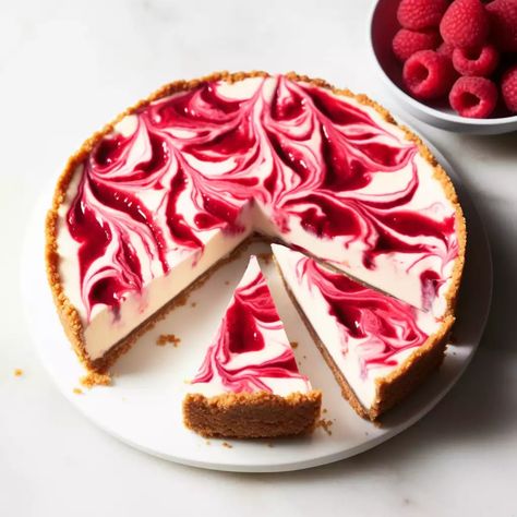 Indulge in a slice of creamy and decadent raspberry swirl cheesecake, a timeless classic with a fruity twist. Classic New York Cheesecake, Dessert Raspberry, Traditional Cheesecake, Raspberry No Bake Cheesecake, Raspberry Swirl Cheesecake, Swirl Cheesecake, Dinner Party Desserts, Raspberry Recipes, Classic Cheesecake