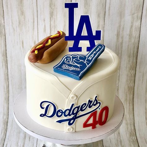 Dodger cake #dodgercake #dodgers #dodgerscake #ladodgers #ladodgerscake #baseballcake #baseball #mlb #mlbcake #hotdogcake #fondanthotdog… La Dodgers Birthday Party, Dodger Party, Hot Dog Cakes, Dodgers Birthday Party, Dodgers Cake, Dodgers Party, Dodgers Gear, Baseball Cake, 11th Birthday