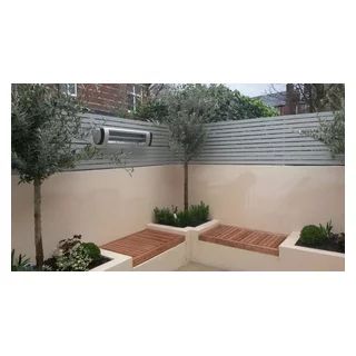 Smart contemporary courtyard. K Rend walls and raised planters, Built-in Iroko hardwood seating. Infra-red outdoor heater. Evergreen planting including Courtyard Landscaping Ideas, Built In Garden Seating, K Rend, Contemporary Courtyard, Raised Planters, Scandinavian Garden, Rooftop Patio Design, Home Decor Ideas Bedroom, Small Courtyard