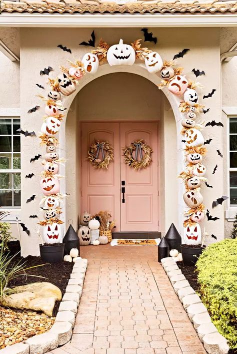 Not all Halloween porch decor has to be orange and black. Use pastel-colored pumpkins and neutral wreaths for a playful front porch. Create an arch around your door by using plastic pumpkins and PVC pipe. Paint them pink and white for cute Halloween porch decor.
#fallporchdecor 
#halloweenporchdecoratingideas #halloweenfrontporchdecor #fallfrontdoordecorentrance #bhg Scary Halloween Porch, Cute Halloween Porch, Porch Decoration Ideas, Halloween Porch Decor, Wreath Frames, Halloween Front Porch Decor, Halloween Porch Decorations, Halloween Front Porch, Decorating Advice