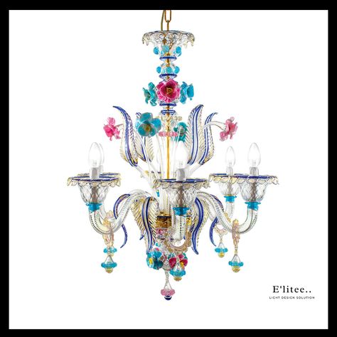 A delightful masterpiece handcrafted of Murano glass and offered in a triumph of colors and floral motifs, this chandelier is a true show-stopper. #chandelier #chandeliers #dramachandelier #chandelierdesign #crystalchandelier #lightingdesign #lightingdesigner #modernlighting #lightingdecor #lightingsolutions #designerlighting #decorativelighting #interiordesign #interiordesignideas #interiordesigninspiration Colorful Chandelier, Classic Chandelier, Blooming Garden, Small Chandelier, Luxury Chandelier, Beautiful Lighting, Venetian Glass, Glass Table Lamp, Floral Motifs