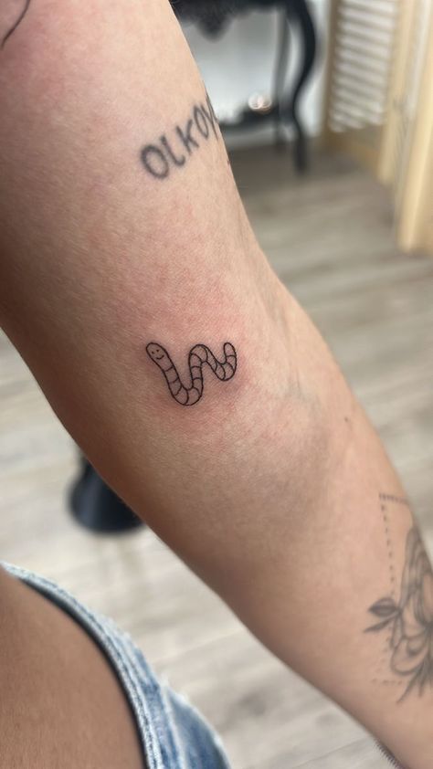 Tiny Worm Tattoo, Even A Worm Will Turn Tattoo, Small Worm Tattoo, Simple Bug Tattoo Ideas, Worm Tattoo Ideas, Weirdo Tattoo Word, Small Caterpillar Tattoo, Ink Box Tattoo Ideas, Cute Worm Tattoo