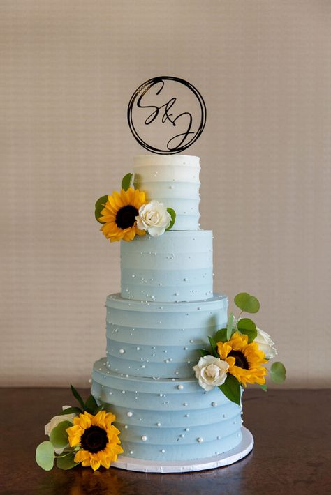 Blue Flowers And Sunflowers, Sunflower And Blue Wedding Cake, Light Blue And Sunflower Wedding Theme, Blue And Sunflower Wedding, Yellow Wedding Cake, Wedding Renewal, Sunflower Themed Wedding, Blue Delphinium, Light Blue Wedding